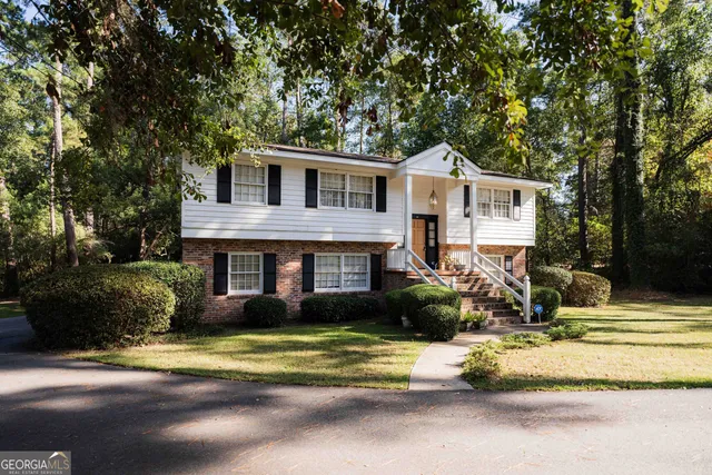 a view of outdoor space with trees all around