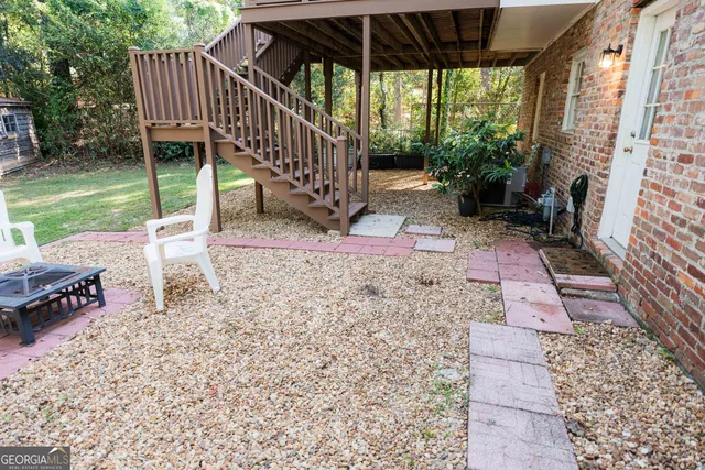 a view of a house with a yard porch and sitting area