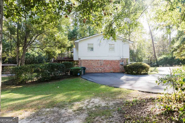 a bedroom with furniture and wooden floor