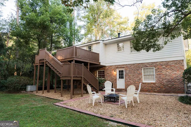 a bathroom with a sink a toilet and a shower