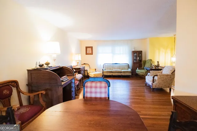 a bathroom with a toilet and a shower curtain