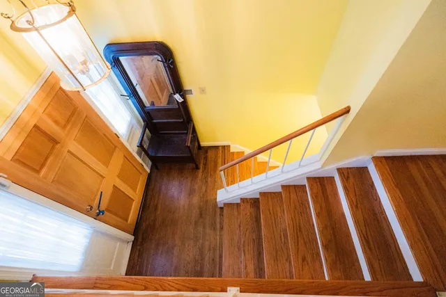 a living room with furniture a ceiling fan and a rug