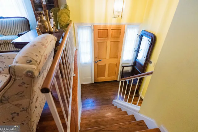 a livingroom with workspace and a window