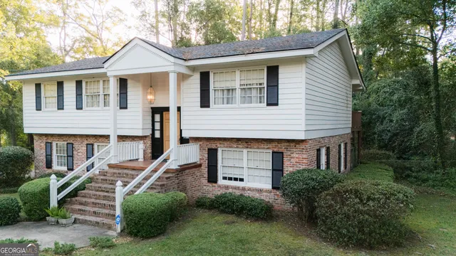 a backyard of a house with lots of green space