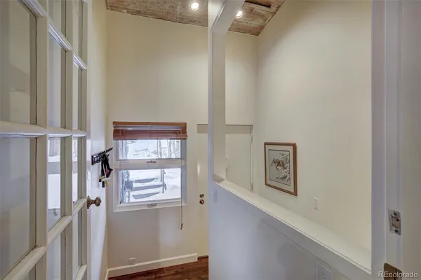 a view of an entryway with wooden floor