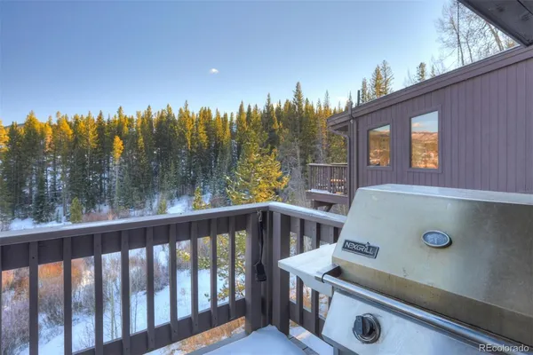 a view of a balcony with trees