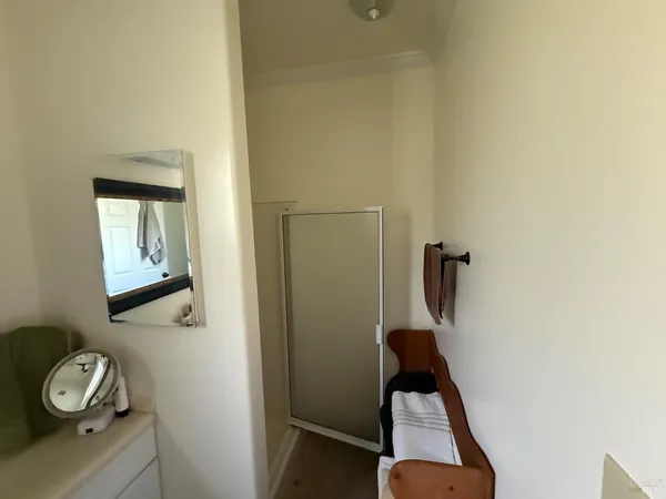 a view of an entryway with wooden floor