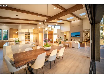 a living room with lots of furniture and a large window
