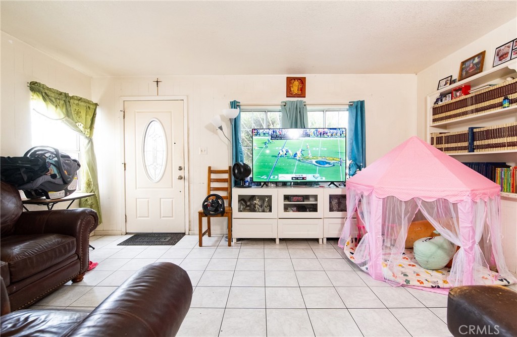 14527 Corlett Avenue Compton, CA 90220 - Photo 7 of 30 a living room with furniture and a couch
