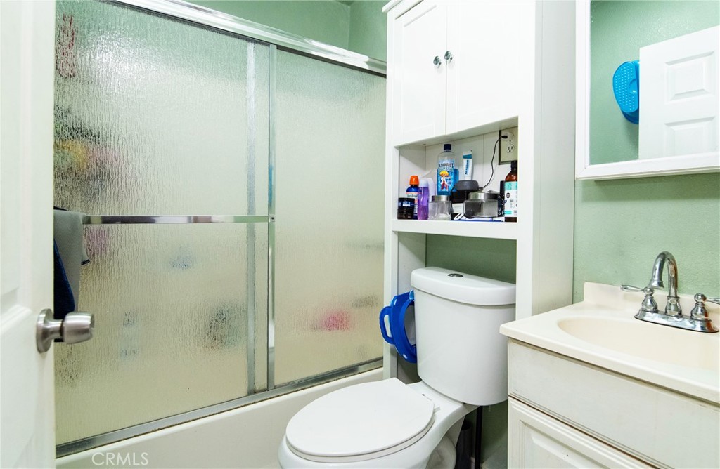 14527 Corlett Avenue Compton, CA 90220 - Photo 10 of 30 a bathroom with a toilet sink vanity and shower