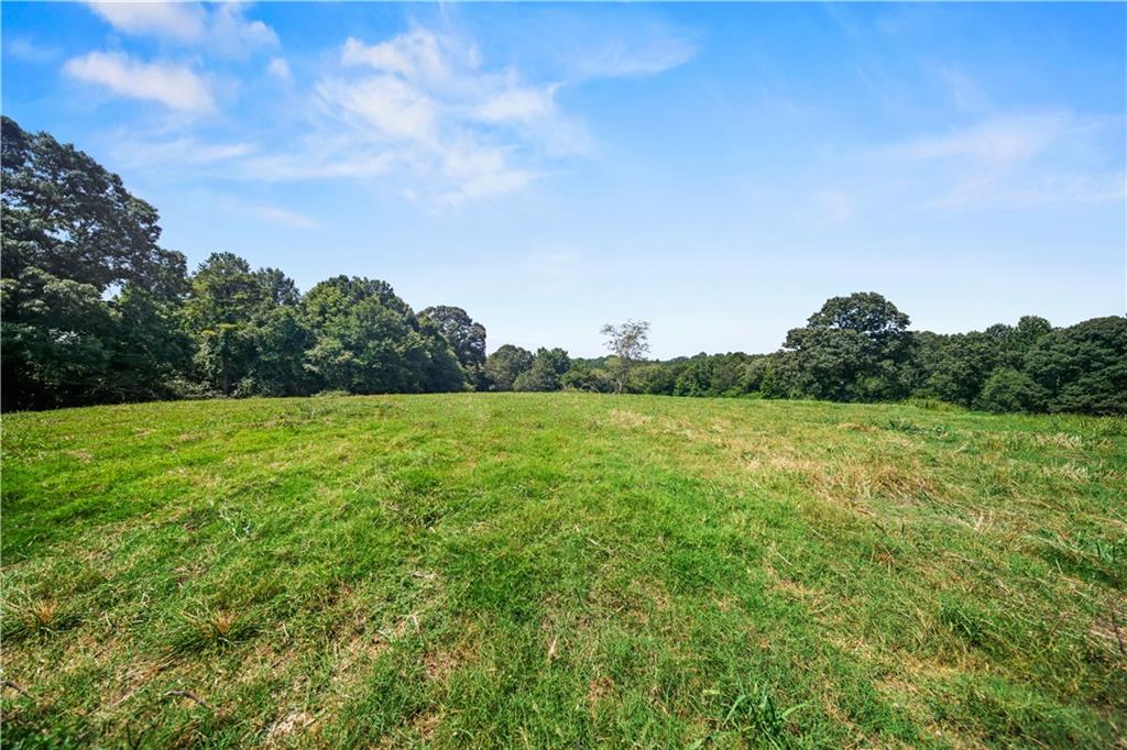 Lot 3 Old State Road Talmo, GA 30575 - Photo 6 of 17 a view of a green field with wooden fence