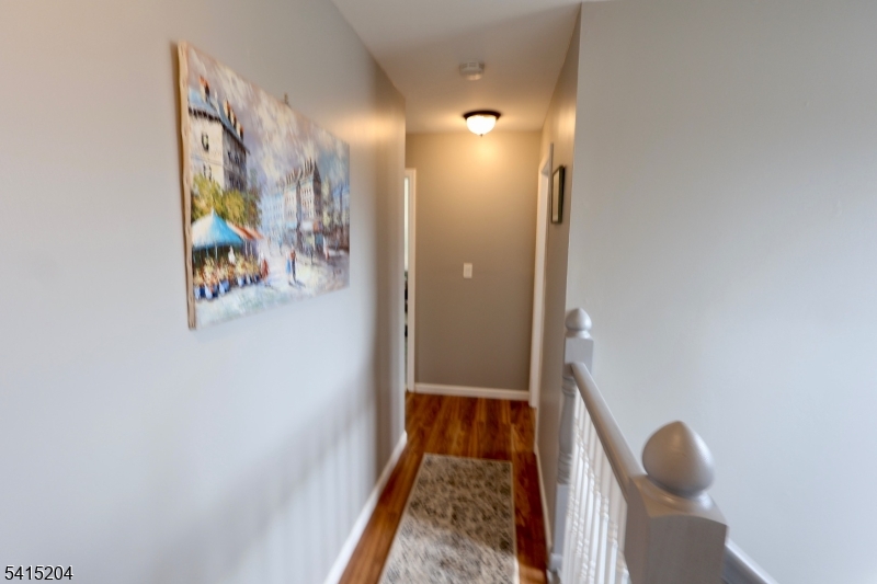 4 Sickle Street Dover, NJ 07801 - Photo 11 of 45 a view of hallway with wooden floor