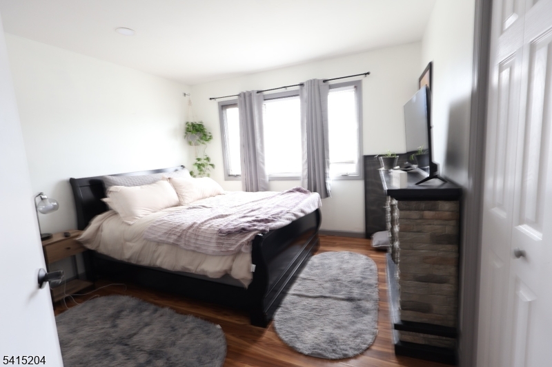 4 Sickle Street Dover, NJ 07801 - Photo 12 of 45 a bedroom with a bed and a dresser