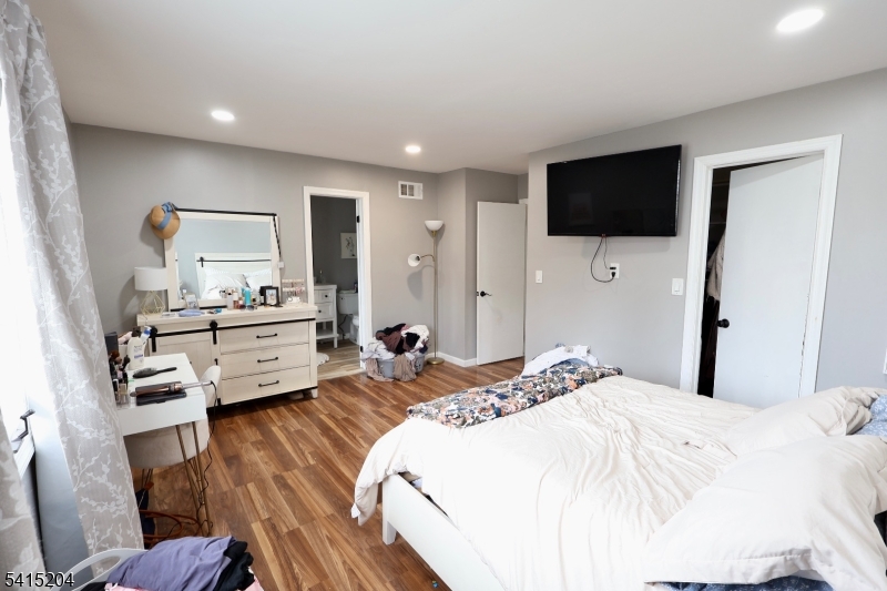 4 Sickle Street Dover, NJ 07801 - Photo 19 of 45 a bedroom with a bed window and a television