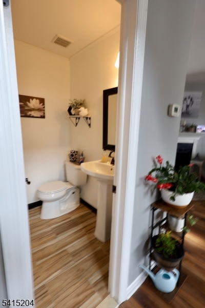 4 Sickle Street Dover, NJ 07801 - Photo 26 of 45 a bathroom with a sink toilet and a mirror