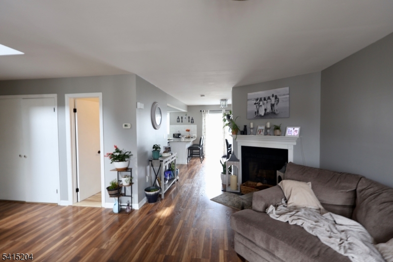 4 Sickle Street Dover, NJ 07801 - Photo 32 of 45 a bedroom with a bed and a fireplace