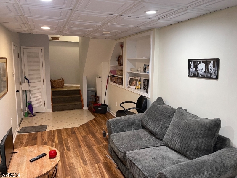 4 Sickle Street Dover, NJ 07801 - Photo 39 of 45 a living room with furniture and a wooden floor