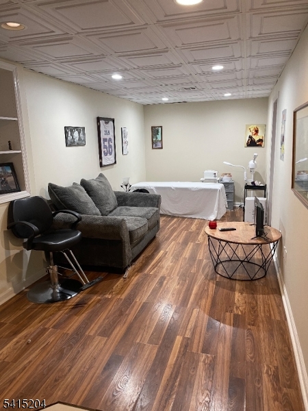4 Sickle Street Dover, NJ 07801 - Photo 41 of 45 a living room with furniture and a wooden floor