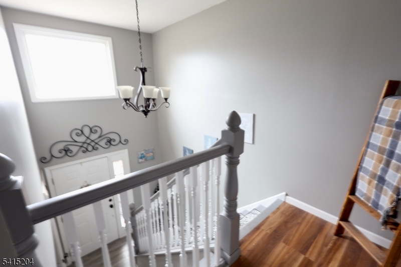 4 Sickle Street Dover, NJ 07801 - Photo 7 of 45 a view of a hallway with wooden floor