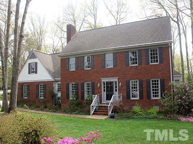 8013 Shellnut Road Raleigh, NC 27615 - Photo 1 of 25 front view of a brick house with a yard