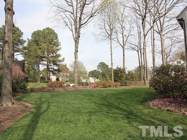 8013 Shellnut Road Raleigh, NC 27615 - Photo 2 of 25 a view of a field of grass and trees