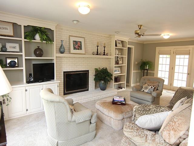 8013 Shellnut Road Raleigh, NC 27615 - Photo 11 of 25 a living room with furniture and a fireplace