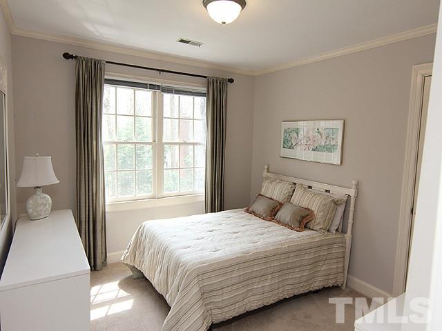 8013 Shellnut Road Raleigh, NC 27615 - Photo 16 of 25 a bedroom with a large bed and a window