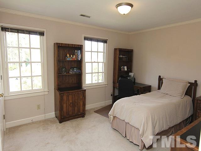 8013 Shellnut Road Raleigh, NC 27615 - Photo 18 of 25 a bedroom with a bed and a window