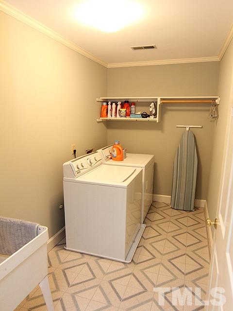 8013 Shellnut Road Raleigh, NC 27615 - Photo 20 of 25 a utility room with a washer and dryer