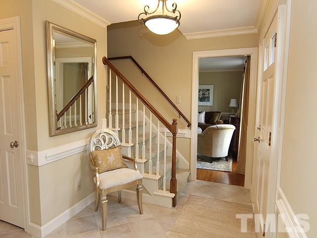 8013 Shellnut Road Raleigh, NC 27615 - Photo 3 of 25 a view of a hallway with wooden floor and furniture