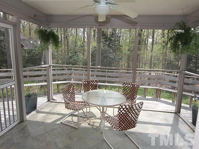 8013 Shellnut Road Raleigh, NC 27615 - Photo 21 of 25 a patio with yard glass top table and chairs