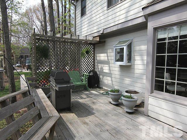 8013 Shellnut Road Raleigh, NC 27615 - Photo 22 of 25 front view of a house with a patio