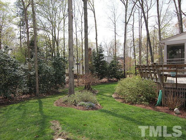 8013 Shellnut Road Raleigh, NC 27615 - Photo 23 of 25 a view of backyard with swimming pool and trees