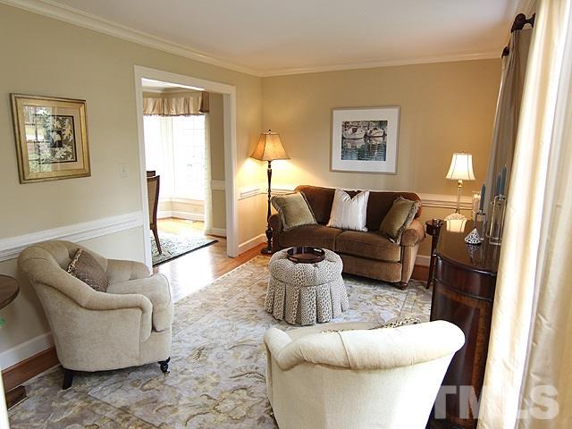 8013 Shellnut Road Raleigh, NC 27615 - Photo 4 of 25 a living room with furniture and a large window
