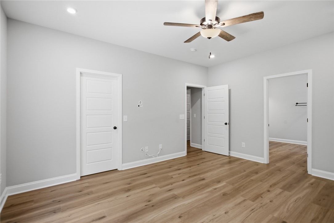 912 Watercrest Road West Union, SC 29696 - Photo 19 of 49 This spacious bedroom offers comfortable living with modern flooring and thoughtful fixtures.