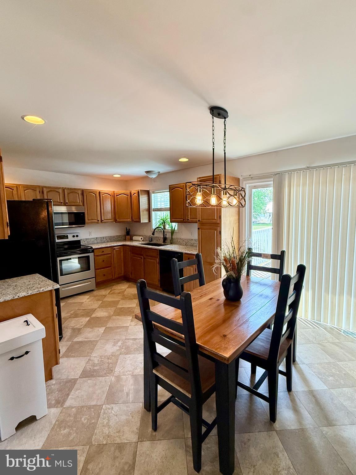 11684 Kensington Way Laurel, DE 19956 - Photo 14 of 43 a dining room with furniture and window