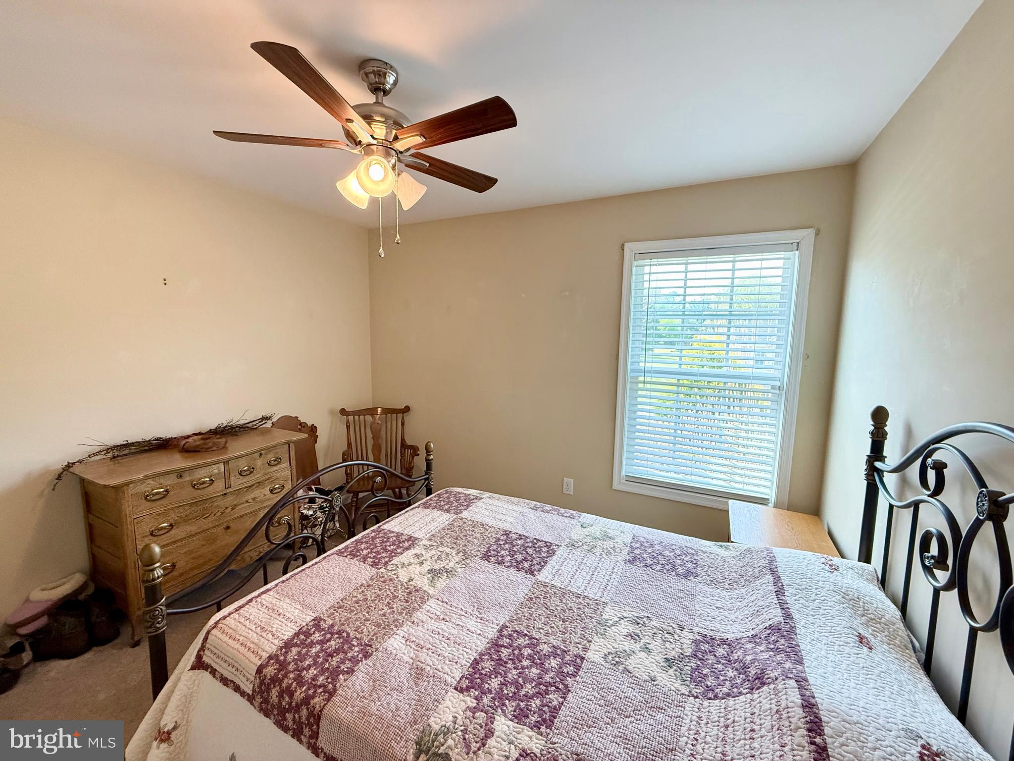 11684 Kensington Way Laurel, DE 19956 - Photo 21 of 43 a bedroom with a bed and a chandelier