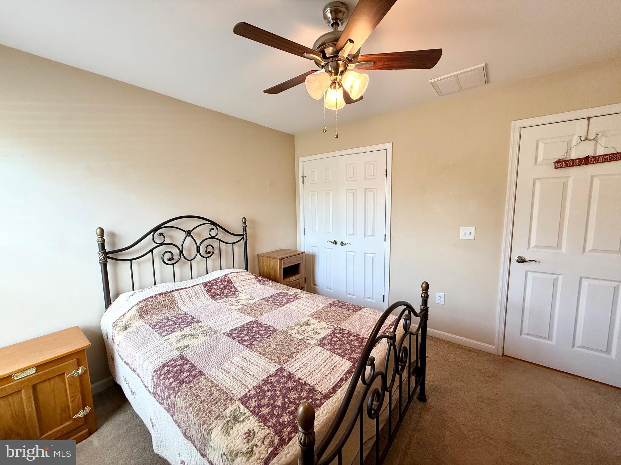 11684 Kensington Way Laurel, DE 19956 - Photo 22 of 43 a bedroom with a bed and a ceiling fan
