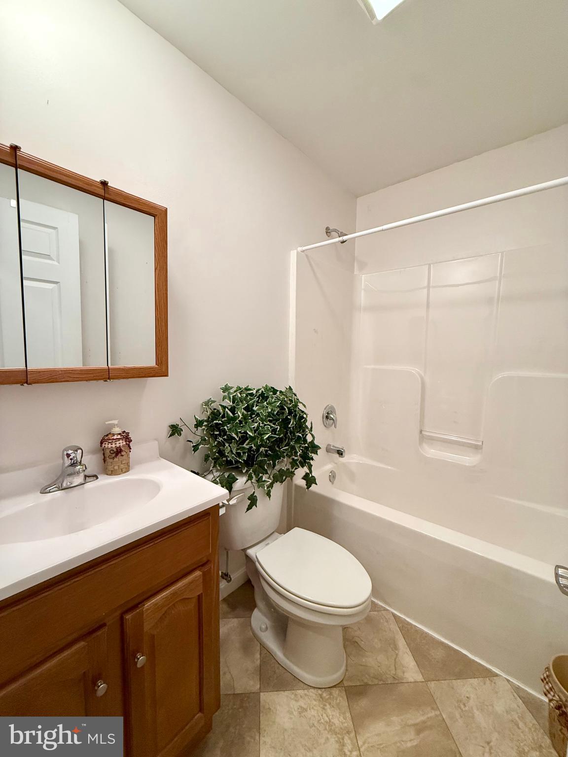 11684 Kensington Way Laurel, DE 19956 - Photo 23 of 43 a bathroom with a sink a toilet and shower