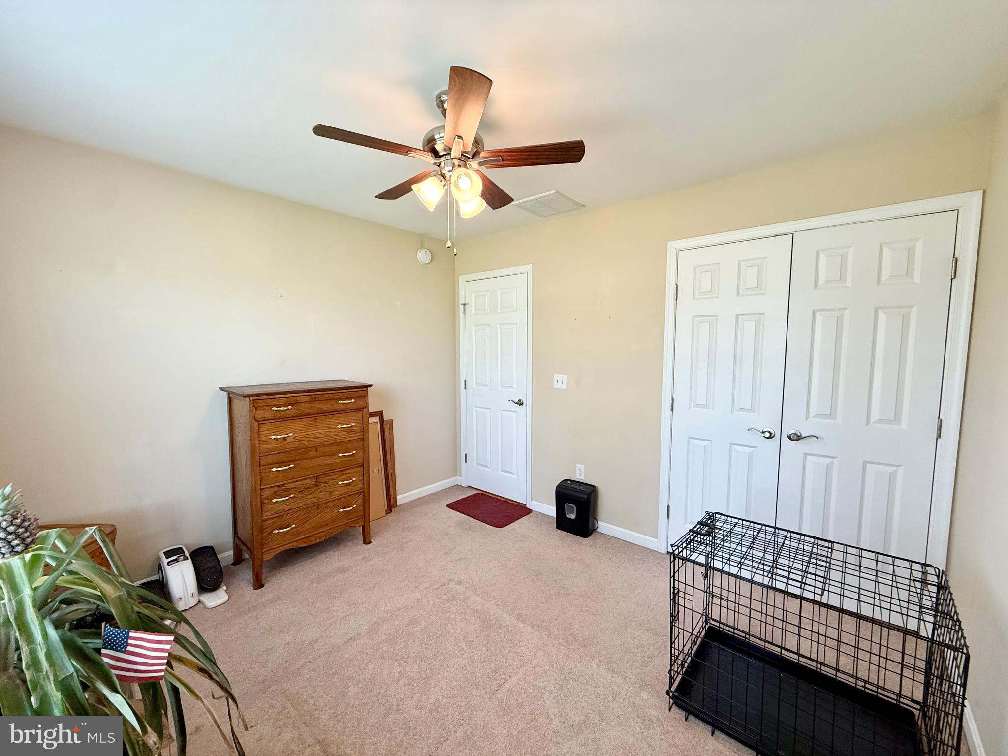 11684 Kensington Way Laurel, DE 19956 - Photo 27 of 43 a bedroom with a bed and a chandelier