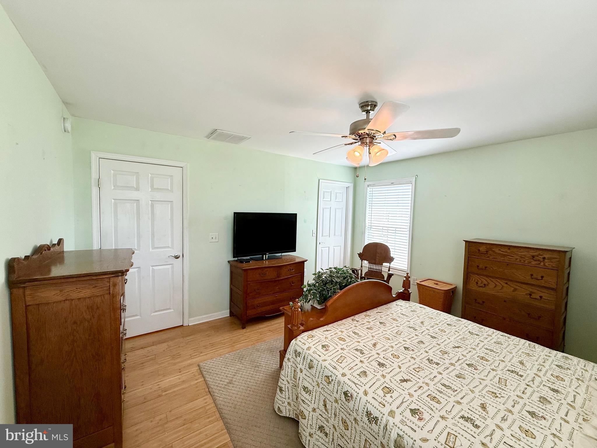 11684 Kensington Way Laurel, DE 19956 - Photo 30 of 43 a bedroom with a bed and a dresser