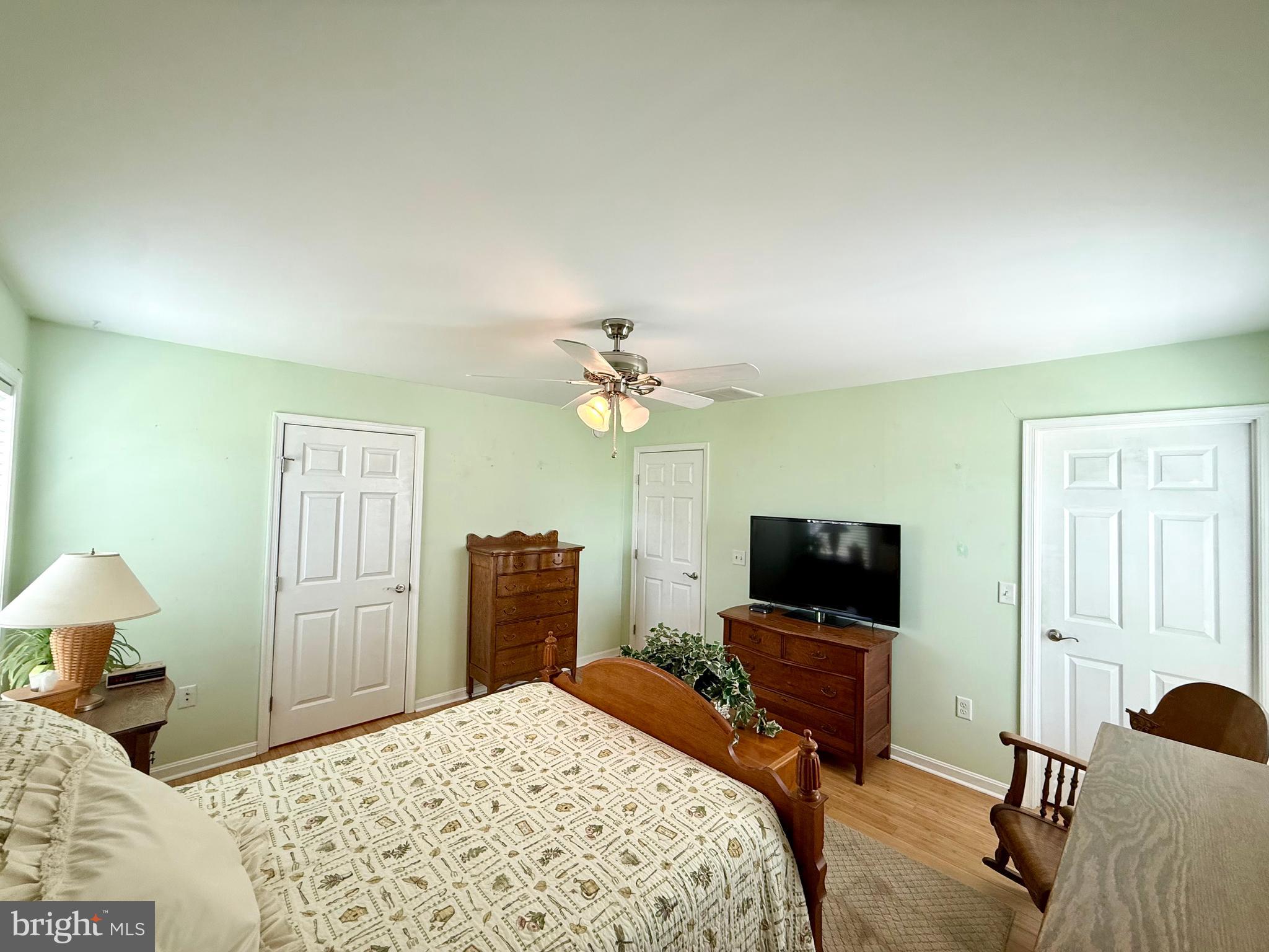 11684 Kensington Way Laurel, DE 19956 - Photo 32 of 43 a bedroom with a bed and a flat screen tv