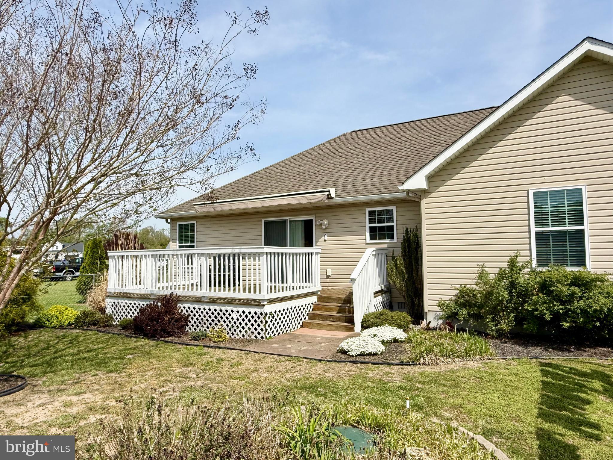 11684 Kensington Way Laurel, DE 19956 - Photo 37 of 43 a view of a house with a small yard plants and large tree