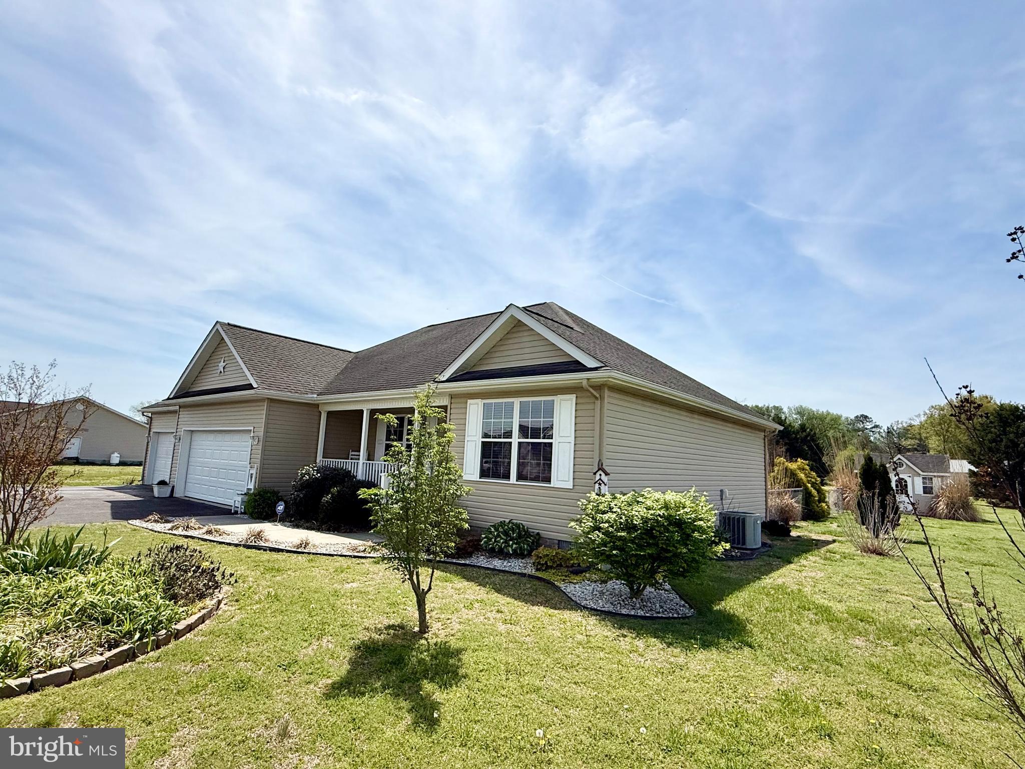 11684 Kensington Way Laurel, DE 19956 - Photo 4 of 43 a house view with swimming pool and garden