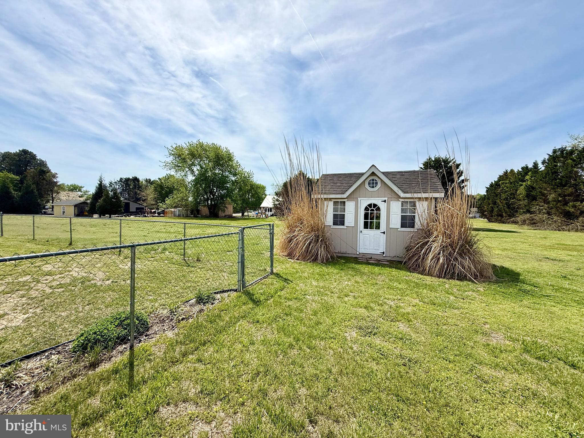 11684 Kensington Way Laurel, DE 19956 - Photo 42 of 43 a view of a house with a big yard and a large tree