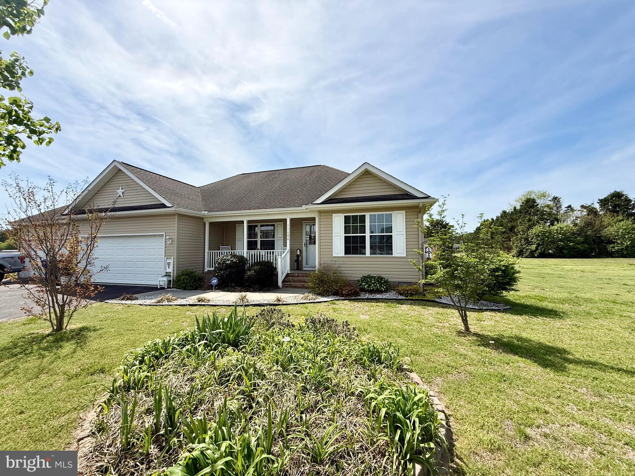 11684 Kensington Way Laurel, DE 19956 - Photo 5 of 43 a front view of a house with a yard