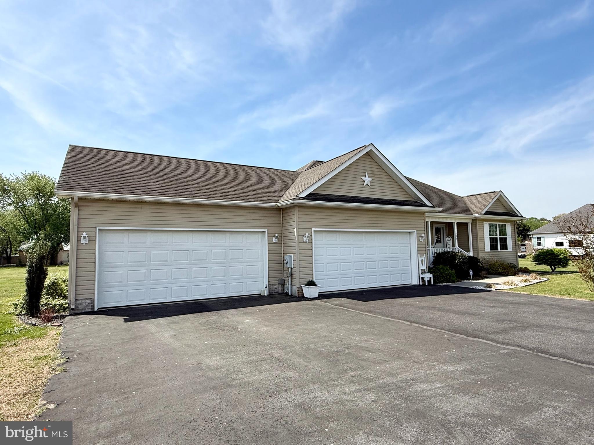 11684 Kensington Way Laurel, DE 19956 - Photo 6 of 43 a front view of a house with a yard and garage
