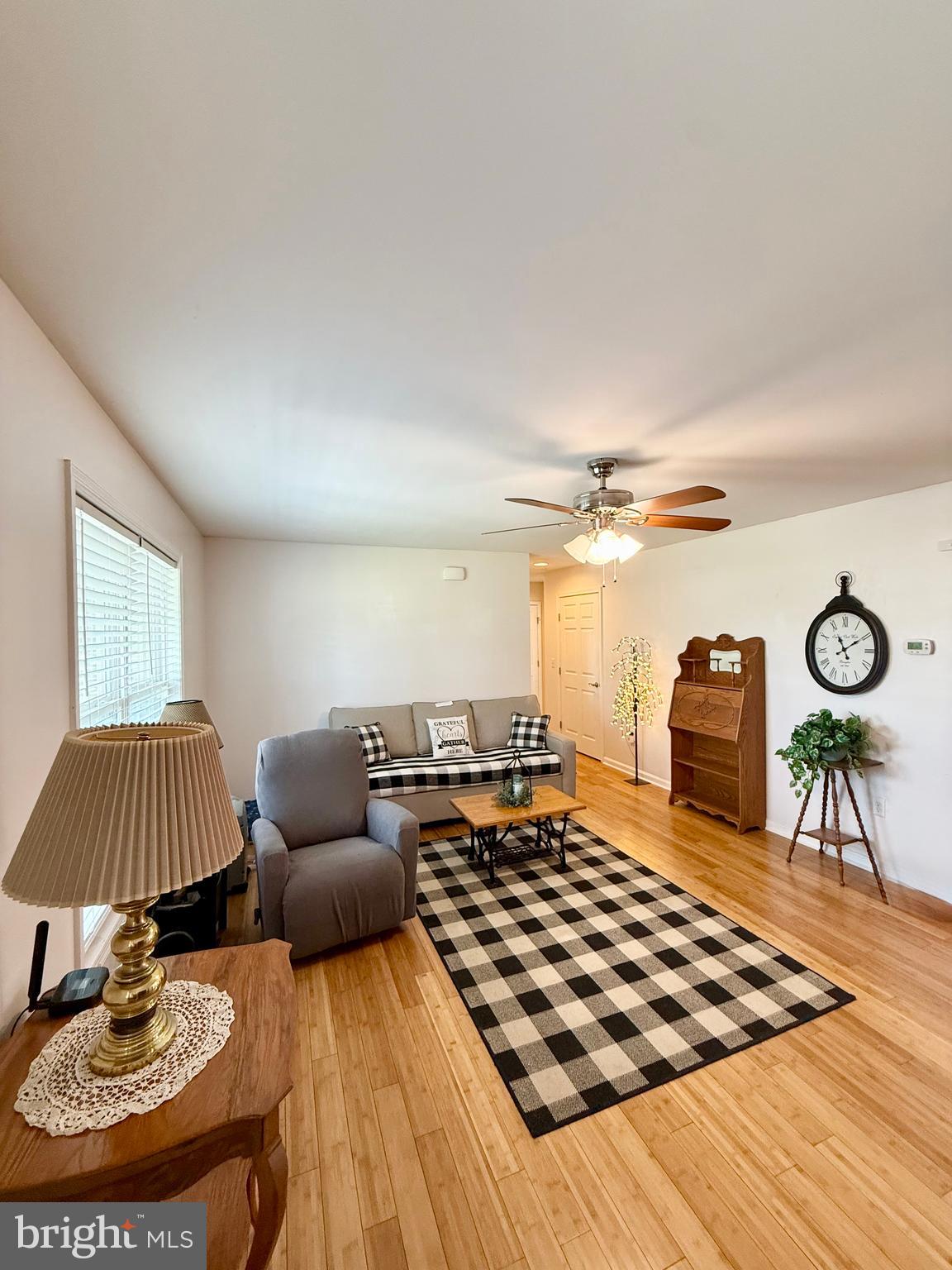 11684 Kensington Way Laurel, DE 19956 - Photo 8 of 43 a living room with furniture and a lamp
