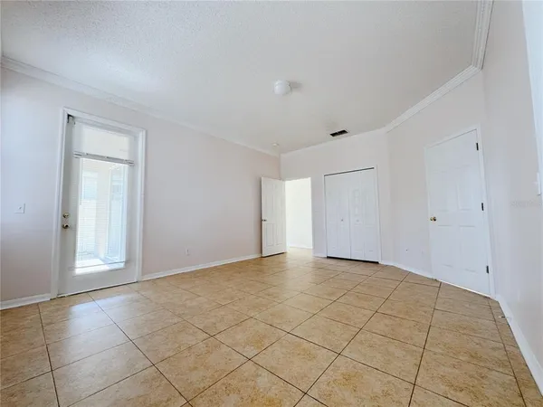 a view of an empty room with a window