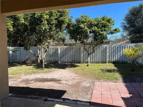 a backyard of a house with lots of green space